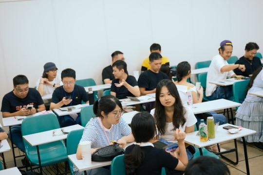 Audience seated for a public lecture