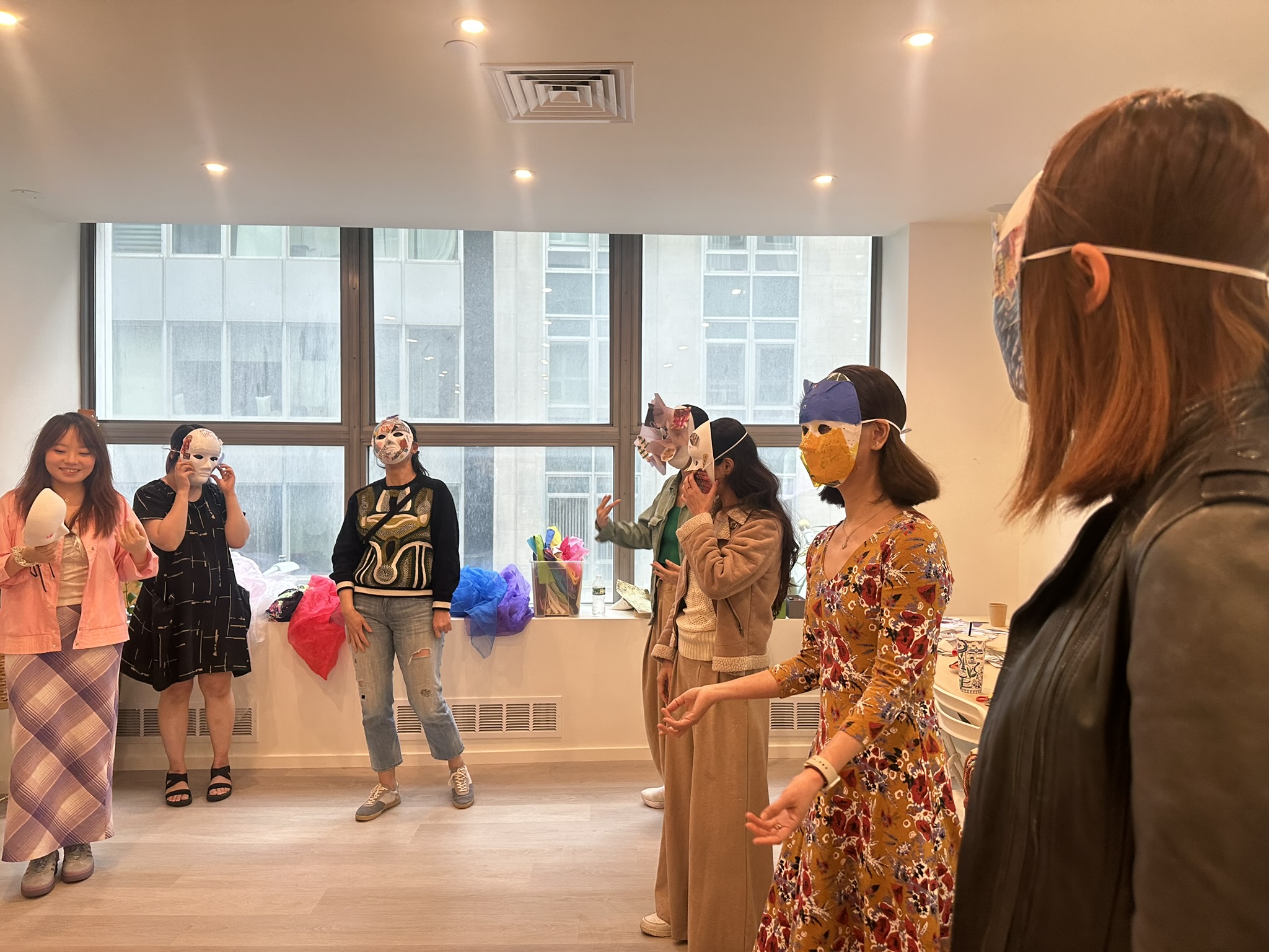 Participants moving in masks during an embodiment exercise