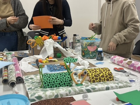 Mixed-media sculpture in progress on a workshop table